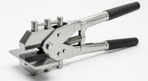 A steel body panel flange tool with a curved red handle and a thin, flat tip, isolated on a white background.